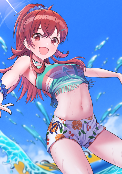 Redhead girl in bikini and shorts at the beach