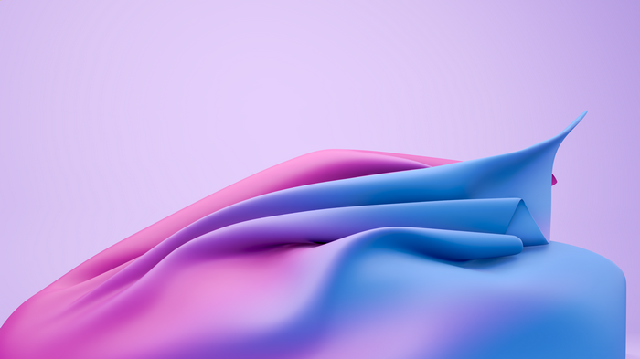 Pink and blue cloth draped over a purple background