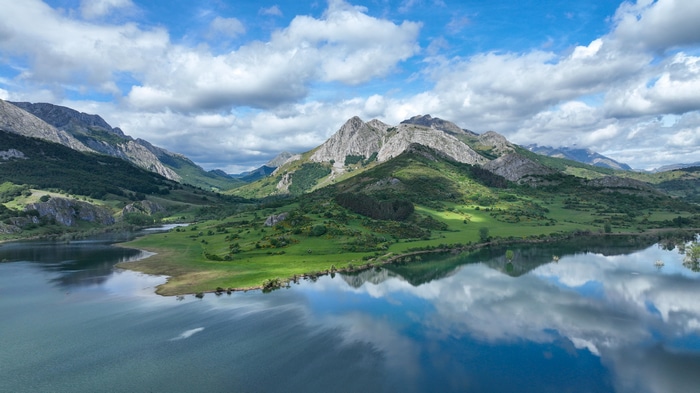 4K lake and mountains landscape with clouds