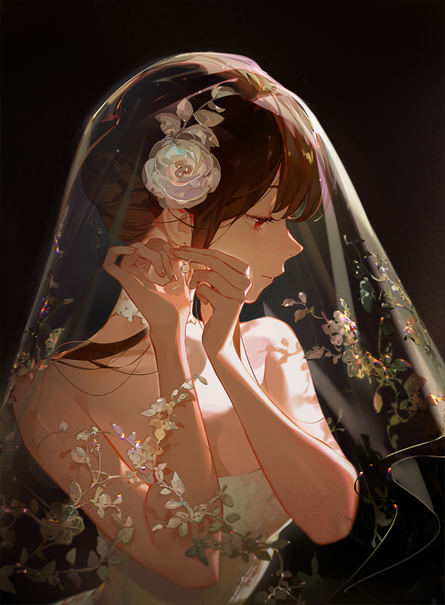 Bride with flower in hair putting on earrings