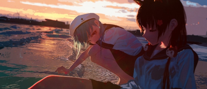 Two girls in sailor uniforms on a beach at sunset
