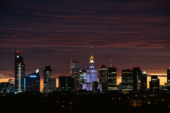 City skyline at dusk with illuminated skyscrapers
