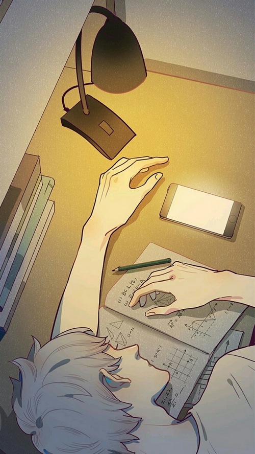 Anime boy studying at a desk with a lamp and phone