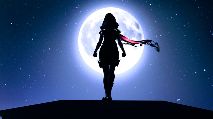 Silhouette of a woman against a large moon and starry night