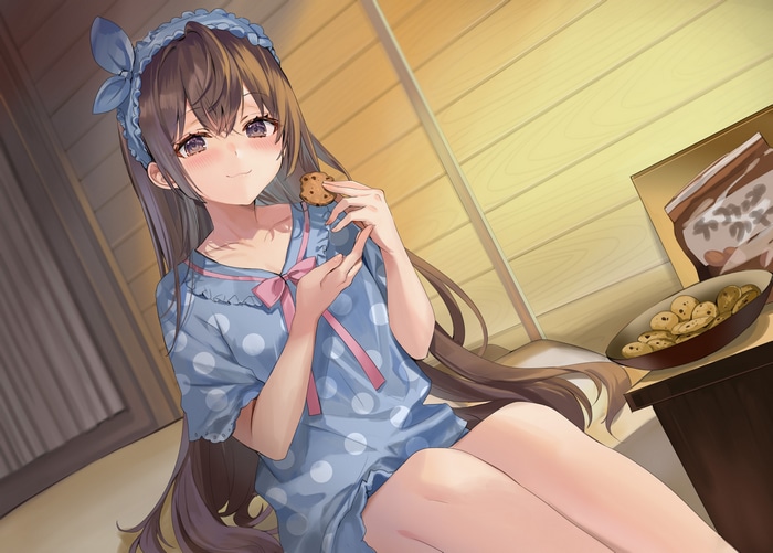 Girl in pajamas eating cookies