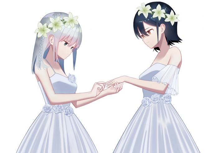 Two women in wedding dresses exchanging rings