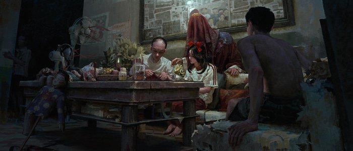 People gathered around a table with dolls and offerings
