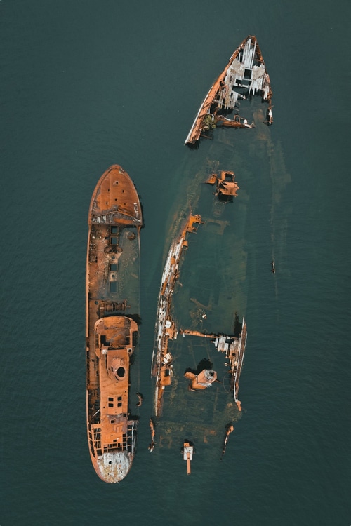 Aerial view of two shipwrecks in the sea