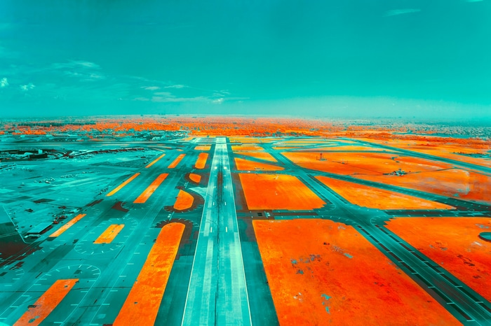 Futuristic abstract airport runway with orange and teal colors