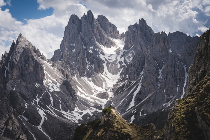 Majestic Alps mountains with snow and clouds