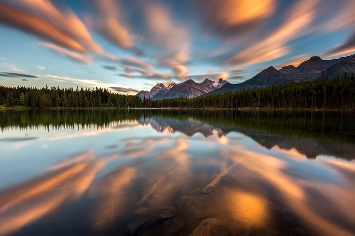 Lake reflection of mountains and clouds in Banff National Park