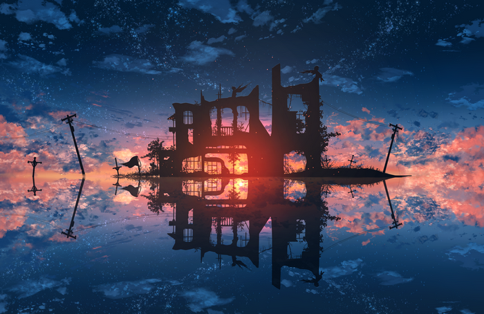 Ruined building reflected in water at sunset