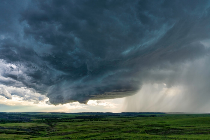 Storm clouds over a green landscape