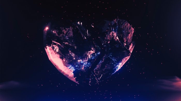 A shattered heart in space with glowing particles