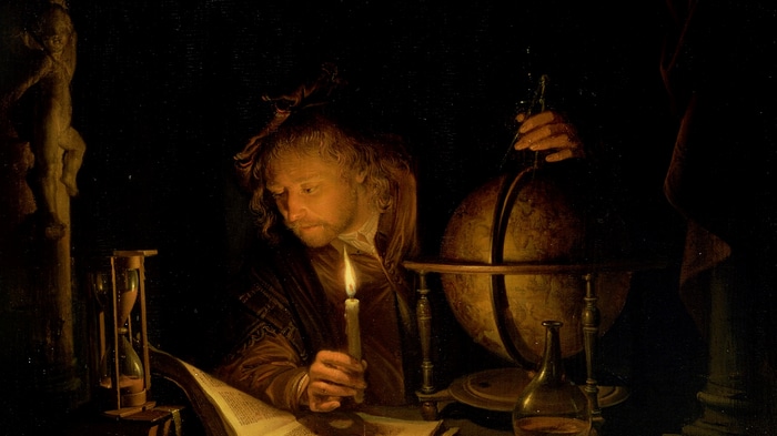 Gerrit Dou painting of an astronomer with a candle and globe