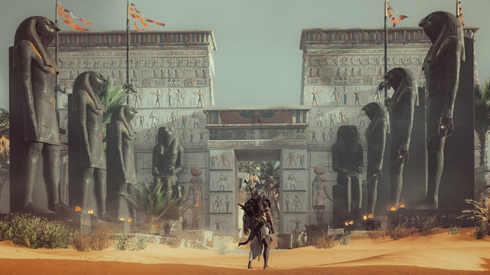 Assassin's Creed Origins: Bayek rides a horse in front of an Egyptian temple