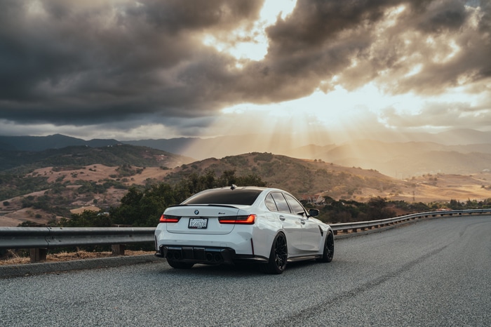 White BMW M3 G80 on a Mountain Road at Sunset