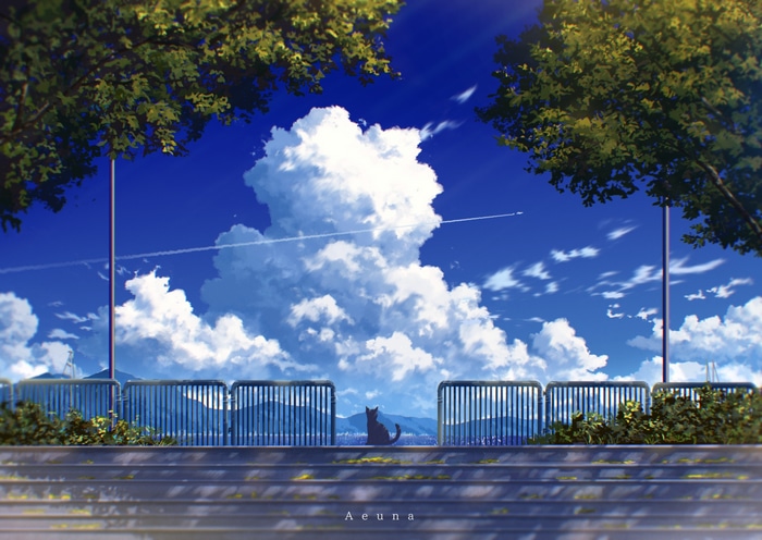 A cat sits on a railing under a cloudy summer sky