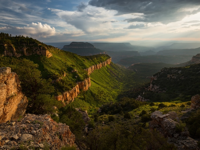 Grand Canyon landscape with sunbeams and clouds