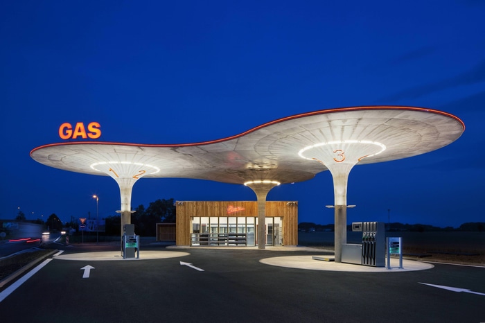Gas station at night with modern canopy