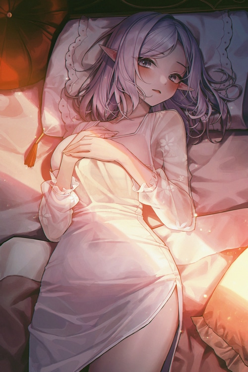 Meoyo lying on a bed with pillows