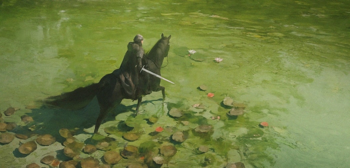 Knight on horseback with sword in a pond