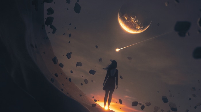 Woman watching meteor shower near a planet