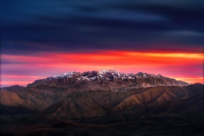 4K sunset over snow-capped mountains