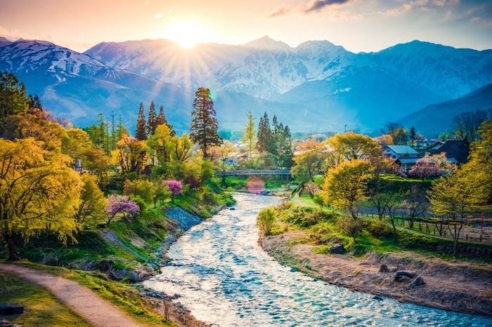 4K Japan sunrise over village, river, and mountains