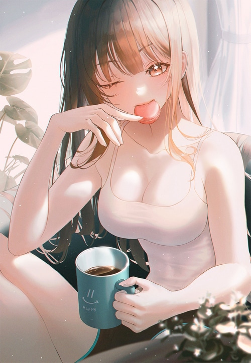 Girl eating a macaron and drinking coffee