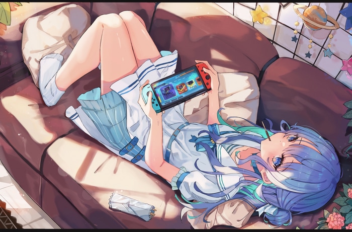 Girl with blue hair playing Nintendo Switch on couch