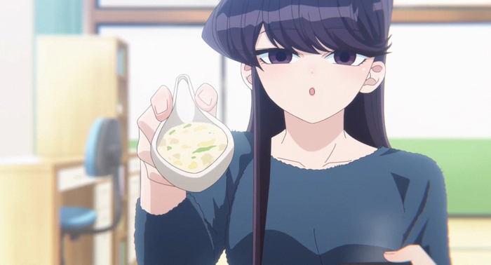 Komi Shouko holds a spoonful of food