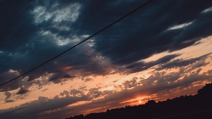 4K Orange Sunset Sky with Clouds and Silhouette