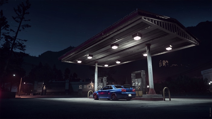 Nissan Skyline R34 at a gas station at night
