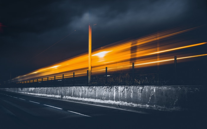 Long exposure light trails of a train at night