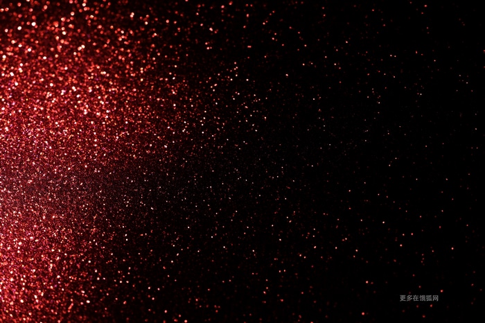 Red glitter bokeh on a black background