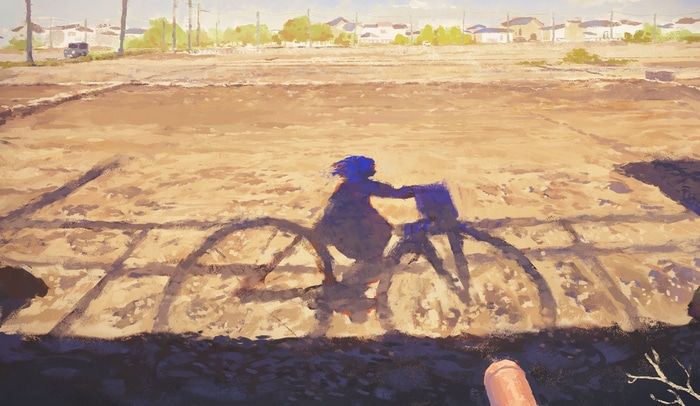 Girl riding a bicycle casting a shadow