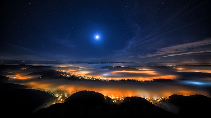 4K Moonlit Night Over Foggy Mountains and Town