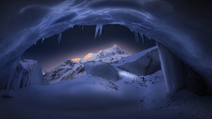 4K Ice Cave with Snowy Mountains and Icicles