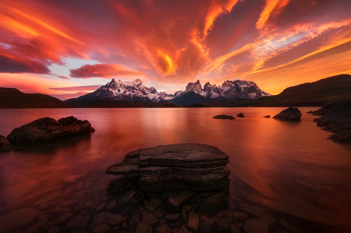 4K Patagonia lake at sunset with mountains and clouds