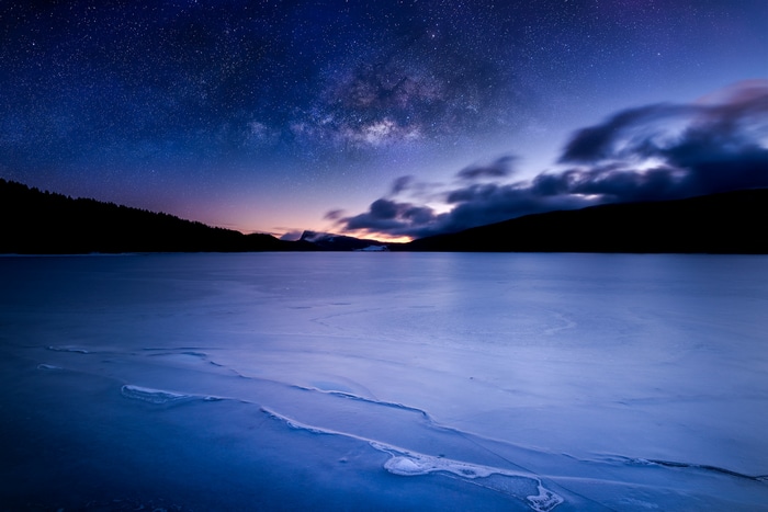 Milky Way over a frozen lake in Switzerland