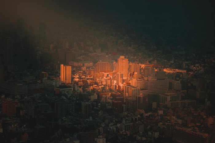 Aerial view of a Japanese cityscape at sunset