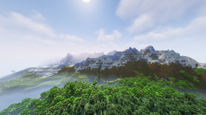 Minecraft landscape with snowy mountains and forests