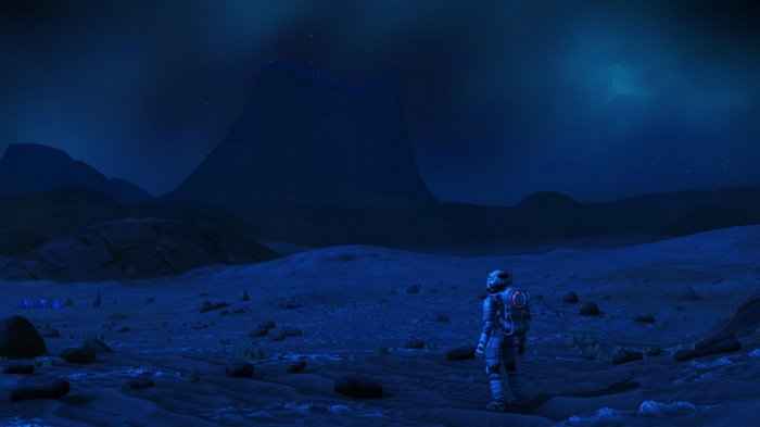 Astronaut on an alien planet at night in No Man's Sky