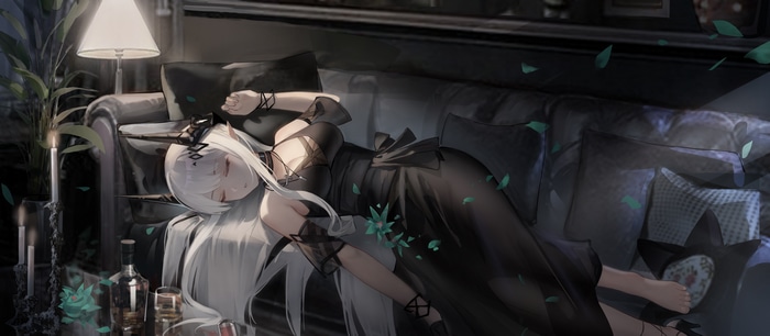 Mudrock sleeping on a couch in a black dress