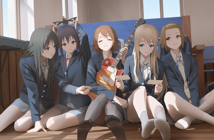 K-ON! girls in school uniforms with a guitar