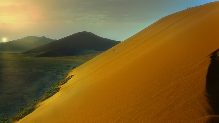 Sunset over Sossusvlei desert dunes in Namibia