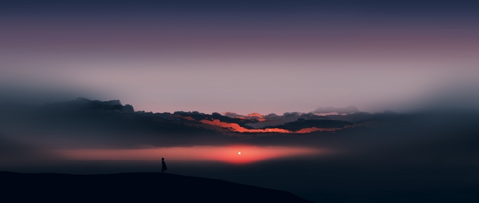 Silhouette against a dramatic sunset with clouds