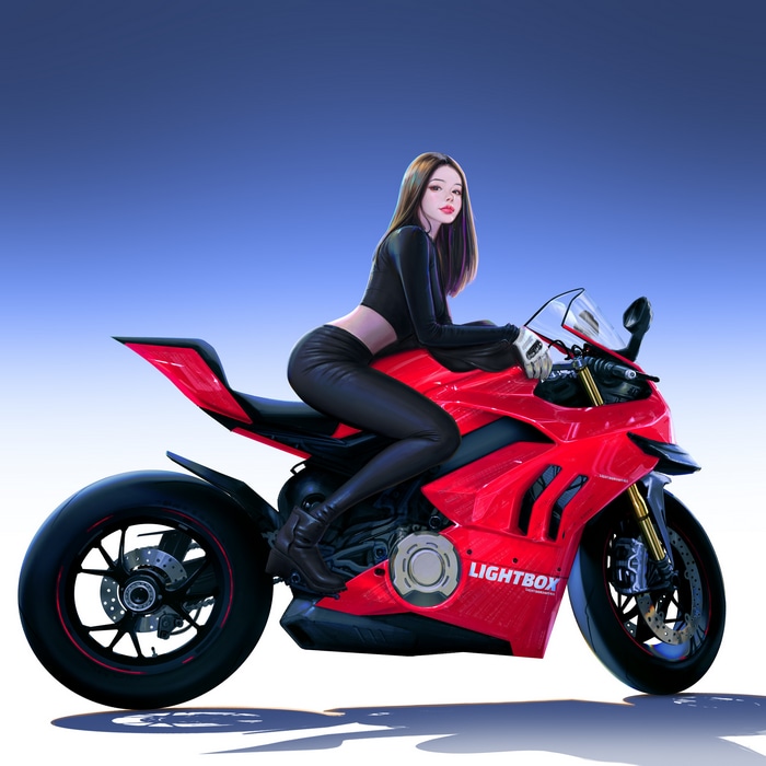 Brunette woman on a red Ducati motorcycle