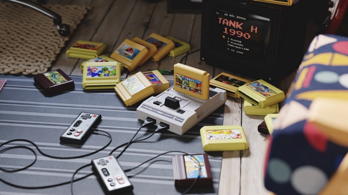 Retro video game console with cartridges and controllers